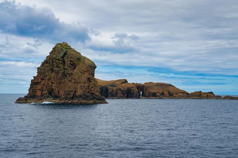 Remote volcanic rock formations and open Atlantic water in the Azores